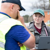A student speaks with a public safety officer.